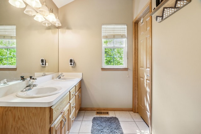 2105 Primrose Dr, Plainfield, IL 60586 - bathroom featuring baseboards, double vanity, tile patterned flooring, and a chandelier