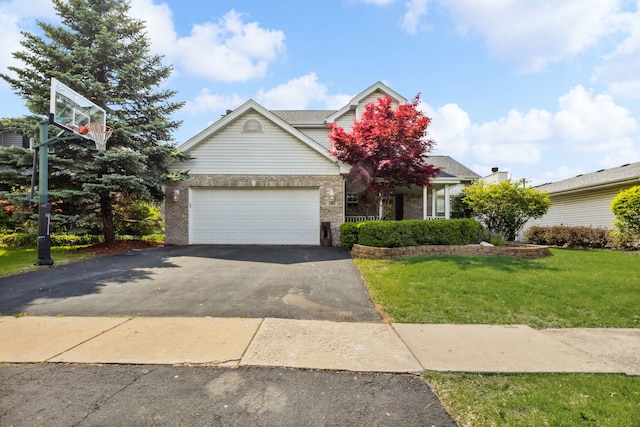 2105 Primrose Dr, Plainfield, IL 60586 - view of front of property with asphalt driveway, a front yard, brick siding, and a garage