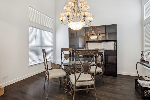 2105 Primrose Dr, Plainfield, IL 60586 - dining area featuring a high ceiling, a chandelier, baseboards, and dark wood-type flooring