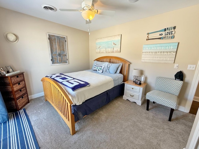 carpeted bedroom with baseboards and ceiling fan