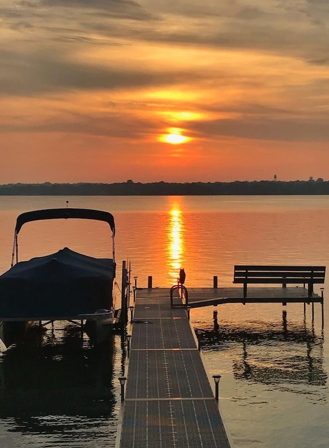 dock with a water view and boat lift