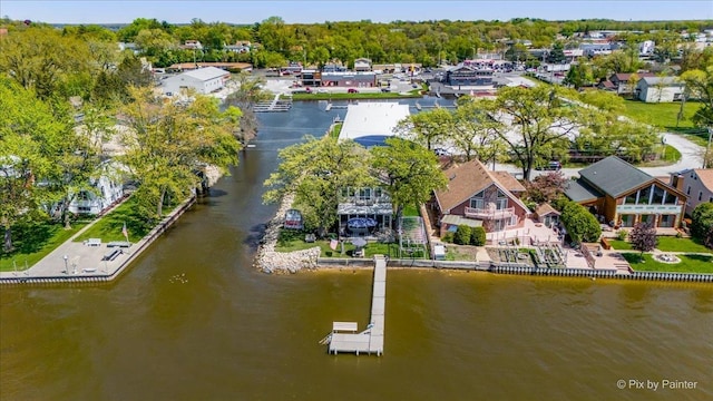 aerial perspective of suburban area with a nearby body of water