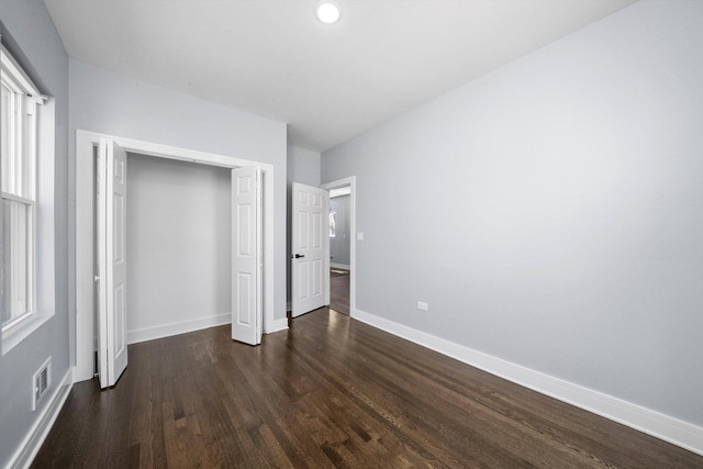 7414 S Aberdeen St, Chicago, IL 60621 - unfurnished bedroom featuring dark wood-style flooring, baseboards, a closet, and recessed lighting