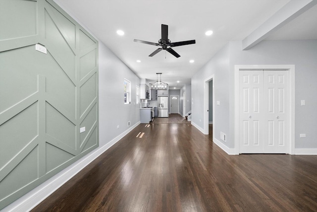 7414 S Aberdeen St, Chicago, IL 60621 - unfurnished living room featuring dark wood-style floors, baseboards, recessed lighting, a ceiling fan, and a chandelier