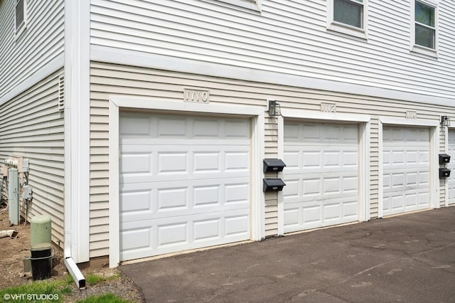 garage featuring driveway