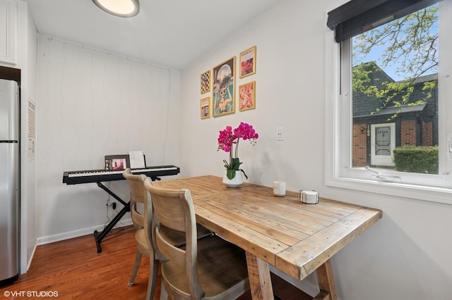dining room with wood finished floors and baseboards