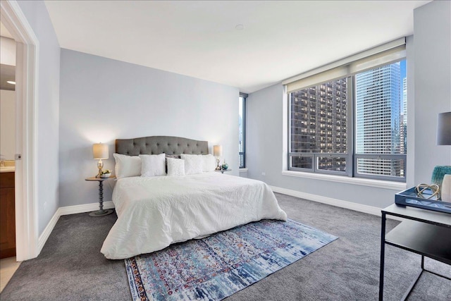 bedroom featuring carpet floors and baseboards
