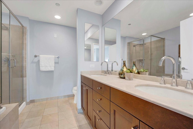 full bathroom with a shower stall, double vanity, baseboards, recessed lighting, and tile patterned flooring