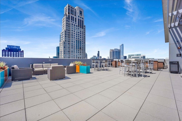 view of patio featuring a view of skyline and an outdoor living space