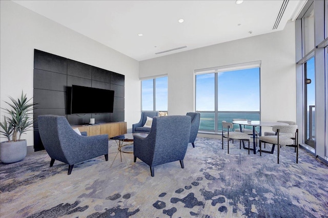 living area with healthy amount of natural light and recessed lighting