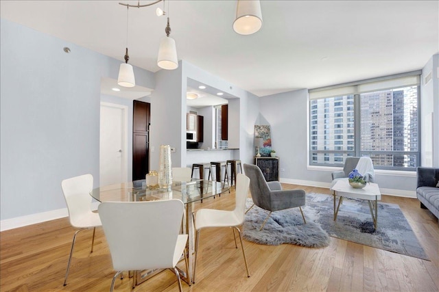 living room with wood finished floors and baseboards