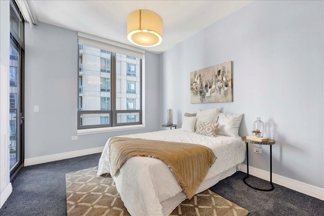 carpeted bedroom with baseboards
