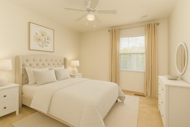 bedroom featuring light colored carpet and ceiling fan
