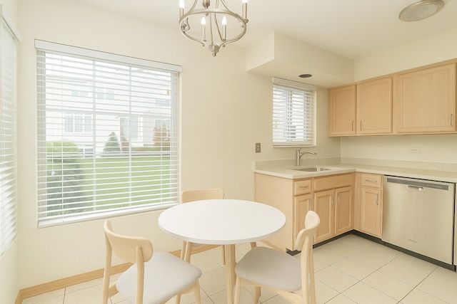 kitchen featuring dishwasher, light brown cabinetry, a chandelier, and plenty of natural light
