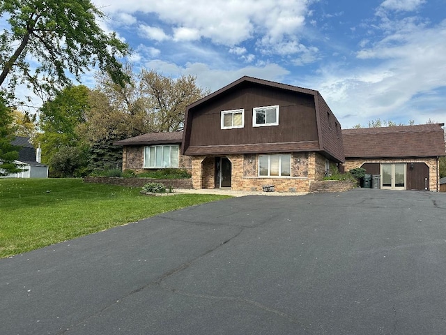 14315 S 92nd St, Orland Park, IL 60462 - split level home with a front lawn, driveway, and stone siding