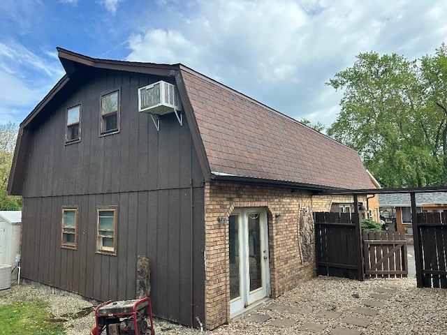 14315 S 92nd St, Orland Park, IL 60462 - rear view of house featuring brick siding, a shingled roof, fence, a gate, and central AC unit