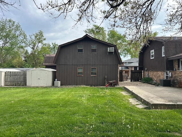 14315 S 92nd St, Orland Park, IL 60462 - rear view of house featuring a storage shed, an outdoor structure, cooling unit, and a patio