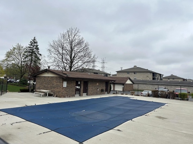 view of pool with fence and a patio area