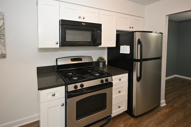 928 Surrey Dr Unit 1A, Schaumburg, IL 60193 - kitchen with stainless steel appliances, dark countertops, dark wood-style flooring, and white cabinets