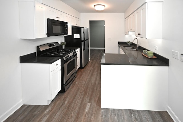 928 Surrey Dr Unit 1A, Schaumburg, IL 60193 - kitchen featuring appliances with stainless steel finishes, dark countertops, dark wood-style flooring, and white cabinetry
