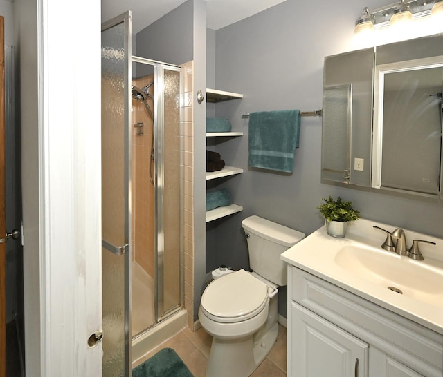 928 Surrey Dr Unit 1A, Schaumburg, IL 60193 - bathroom with vanity, a shower stall, and tile patterned flooring