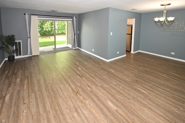 928 Surrey Dr Unit 1A, Schaumburg, IL 60193 - spare room with a chandelier and wood finished floors
