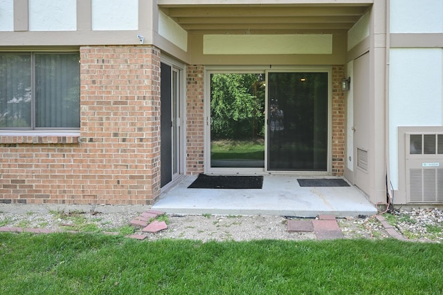 928 Surrey Dr Unit 1A, Schaumburg, IL 60193 - entrance to property with brick siding, stucco siding, and a patio area