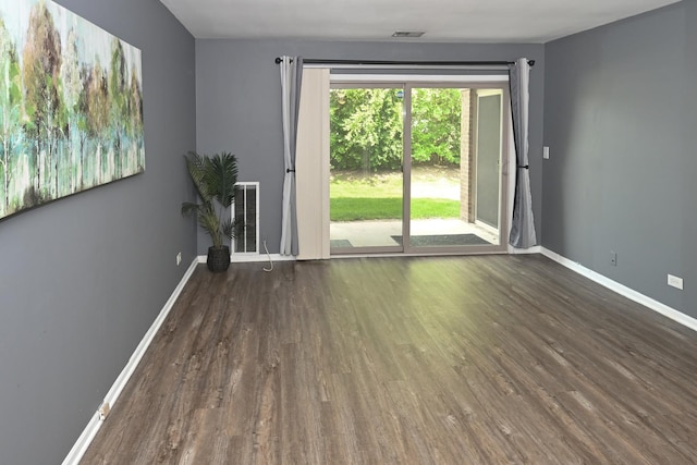 928 Surrey Dr Unit 1A, Schaumburg, IL 60193 - spare room with wood finished floors and baseboards