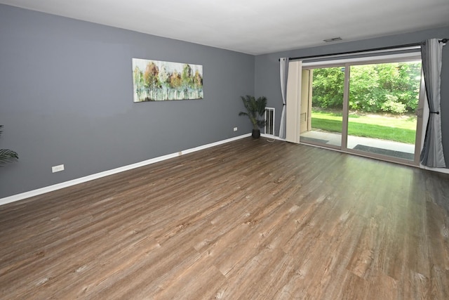 928 Surrey Dr Unit 1A, Schaumburg, IL 60193 - empty room with wood finished floors