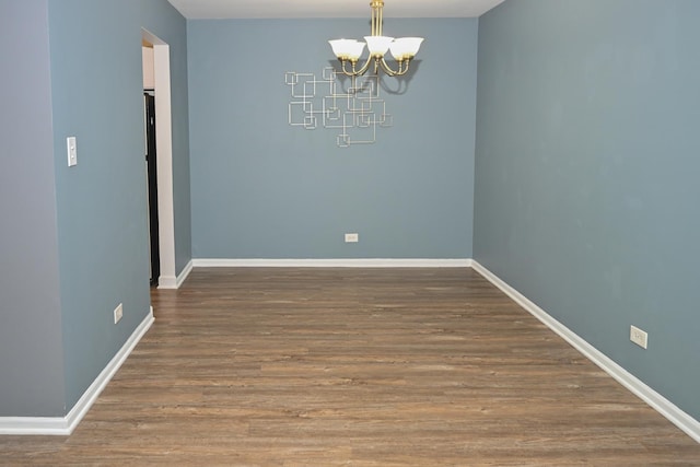 928 Surrey Dr Unit 1A, Schaumburg, IL 60193 - spare room with a chandelier and wood finished floors