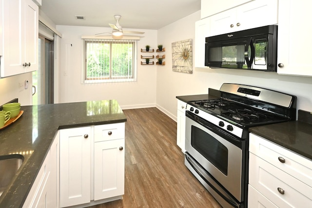 928 Surrey Dr Unit 1A, Schaumburg, IL 60193 - kitchen with stainless steel gas range oven, black microwave, white cabinets, and dark wood-style floors