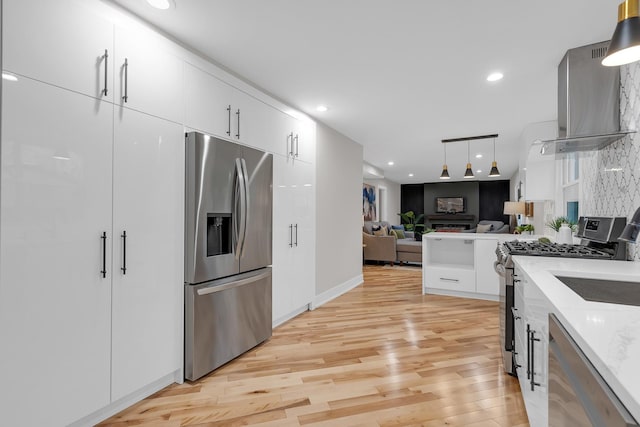 274 University Dr, Buffalo Grove, IL 60089 - kitchen featuring stainless steel appliances, white cabinetry, light wood-type flooring, open floor plan, and wall chimney range hood