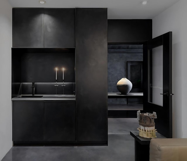 3845 S Winchester Ave, Chicago, IL 60609 - kitchen with modern cabinets, finished concrete floors, and dark cabinets