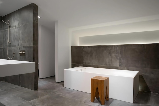 3845 S Winchester Ave, Chicago, IL 60609 - full bathroom with tile walls, a tile shower, concrete floors, and a tub to relax in