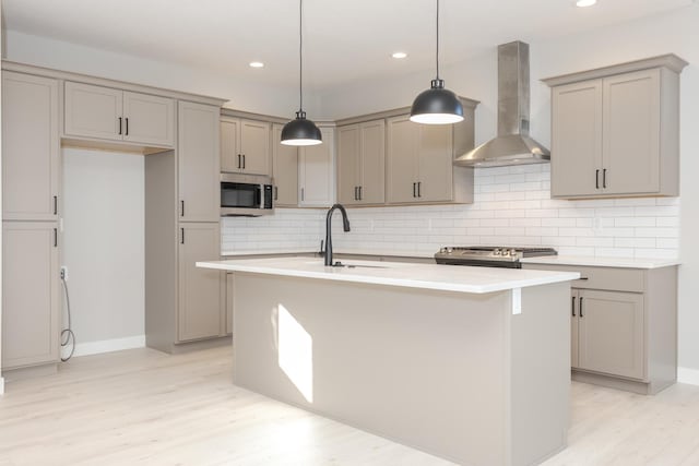 1904 Dunraven Rd, Bloomington, IL 61704 - kitchen featuring wall chimney range hood, gray cabinets, a sink, and recessed lighting