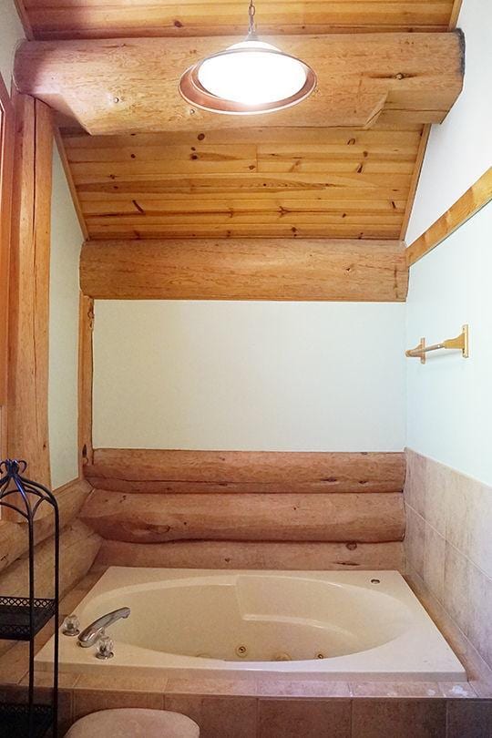 3526 E 2179th Rd, Ottawa, IL 61350 - full bathroom with rustic walls, a jetted tub, wooden ceiling, and lofted ceiling