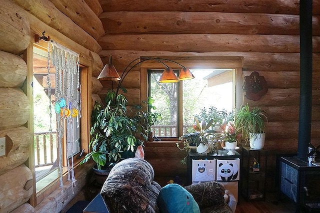 3526 E 2179th Rd, Ottawa, IL 61350 - living area with log walls, a wood stove, and wood finished floors