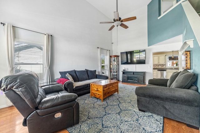 2124 Northwood Dr, Belvidere, IL 61008 - living area with ceiling fan, light wood-style flooring, and high vaulted ceiling