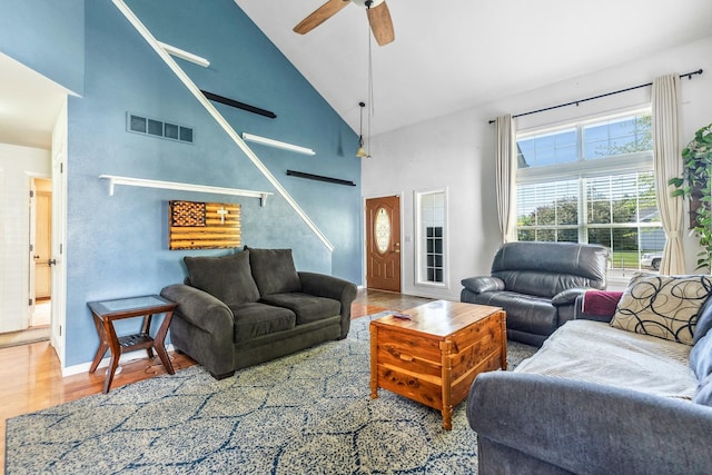 2124 Northwood Dr, Belvidere, IL 61008 - living area with ceiling fan, high vaulted ceiling, stairs, wood finished floors, and baseboards