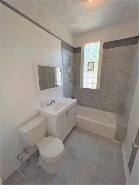 12256 S Union Ave, Chicago, IL 60628 - bathroom with washtub / shower combination, toilet, and vanity
