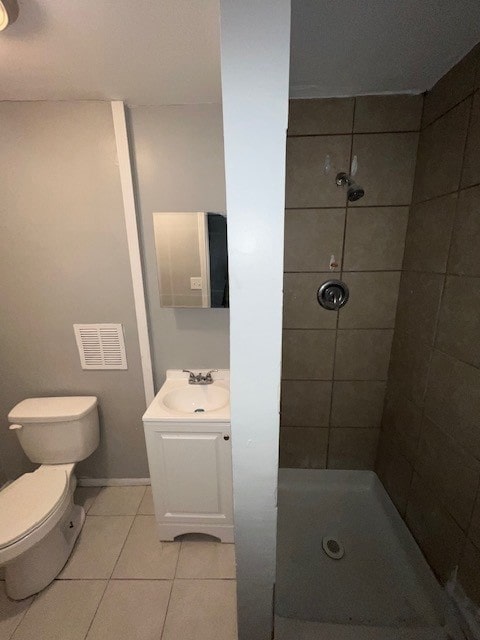12256 S Union Ave, Chicago, IL 60628 - bathroom featuring tile patterned flooring, a stall shower, toilet, and vanity