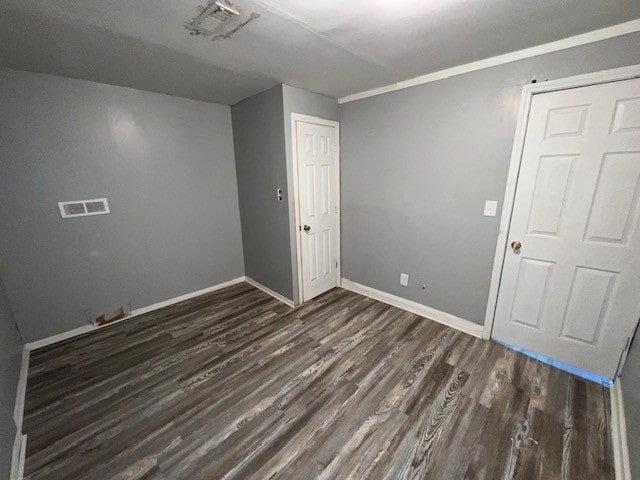 12256 S Union Ave, Chicago, IL 60628 - unfurnished room with dark wood finished floors and baseboards