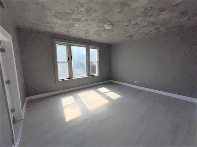 12256 S Union Ave, Chicago, IL 60628 - unfurnished room featuring baseboards and wood finished floors