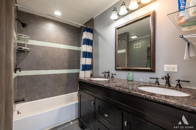 full bathroom with shower / bath combo with shower curtain, double vanity, and tile patterned floors