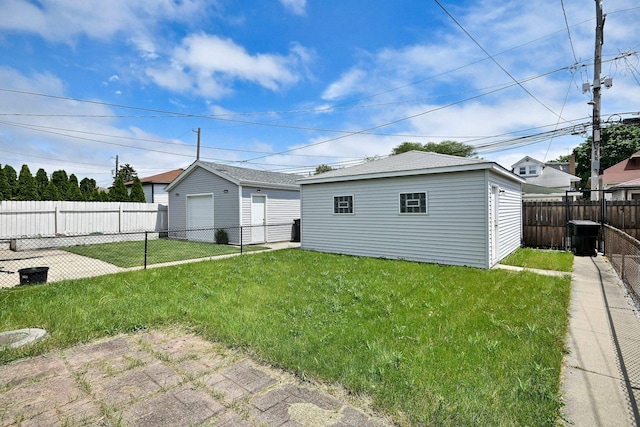 3113 N Major Ave, Chicago, IL 60634 - rear view of house with a garage and an outbuilding