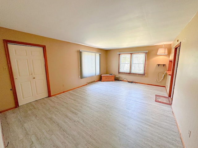 925 N Otter Creek Rd, Streator, IL 61364 - unfurnished living room featuring wood finished floors and baseboards