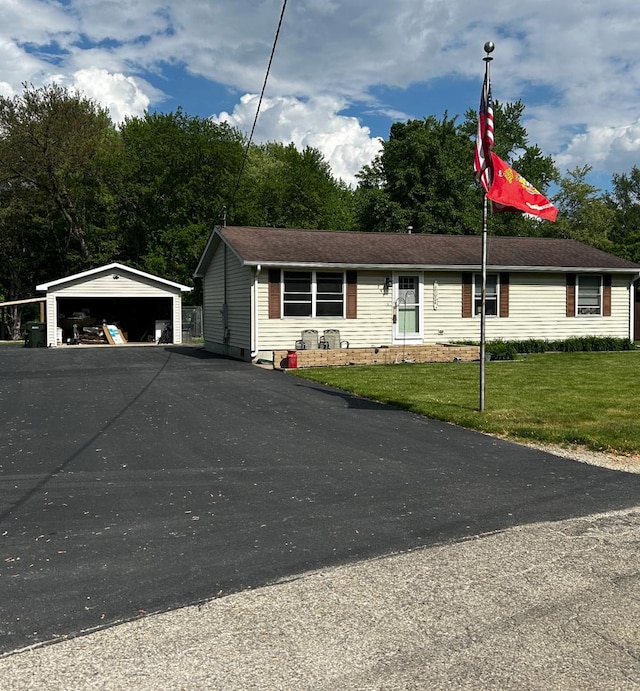 795 N Erie St, Braidwood, IL 60408 - view of front of home with a garage, a front lawn, and an outbuilding
