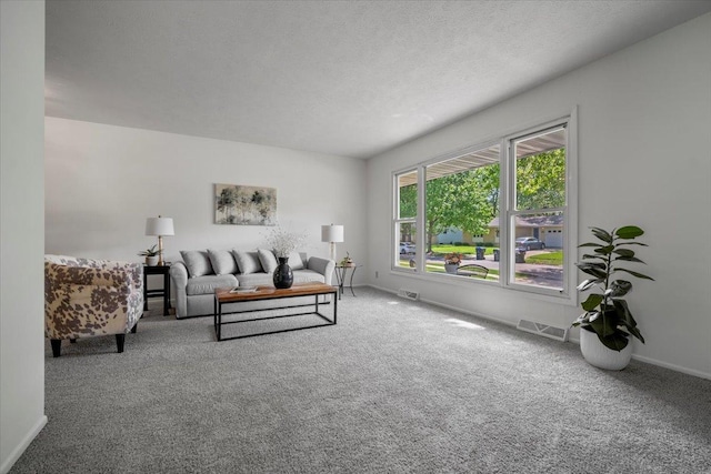 carpeted living area featuring baseboards