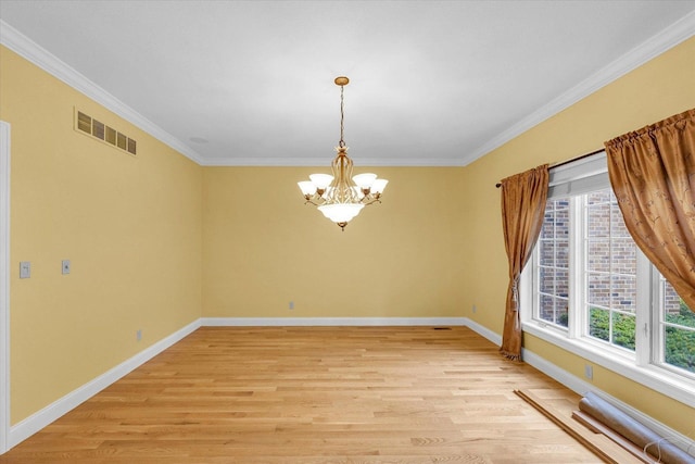 4410 Southford Trace Dr, Champaign, IL 61822 - spare room featuring plenty of natural light, a chandelier, light wood-type flooring, and crown molding