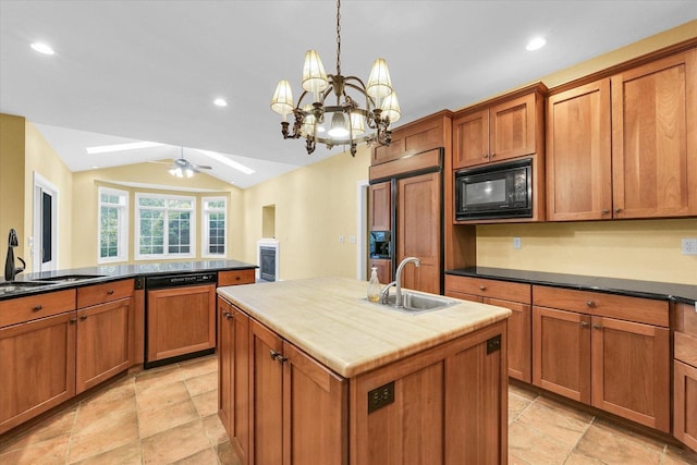 4410 Southford Trace Dr, Champaign, IL 61822 - kitchen featuring built in appliances, a sink, vaulted ceiling, a skylight, and a kitchen island with sink